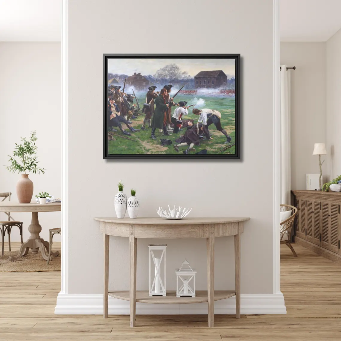 The Battle of Lexington framed canvas hung above a console table in a bright, airy entryway