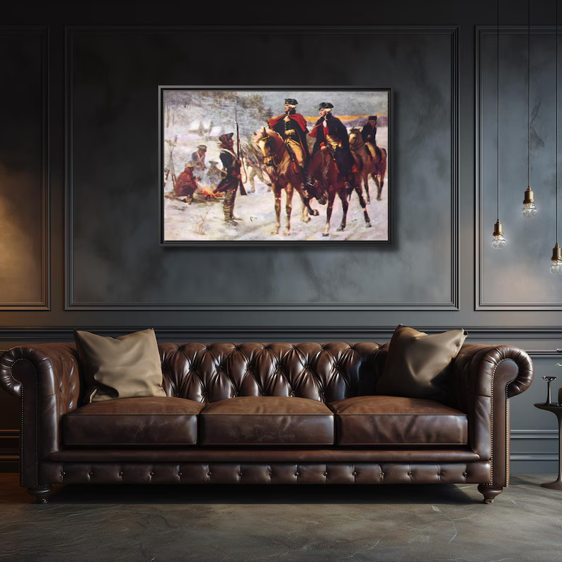 Washington and Lafayette at Valley Forge framed canvas above a cognac leather Chesterfield sofa in a paneled study
