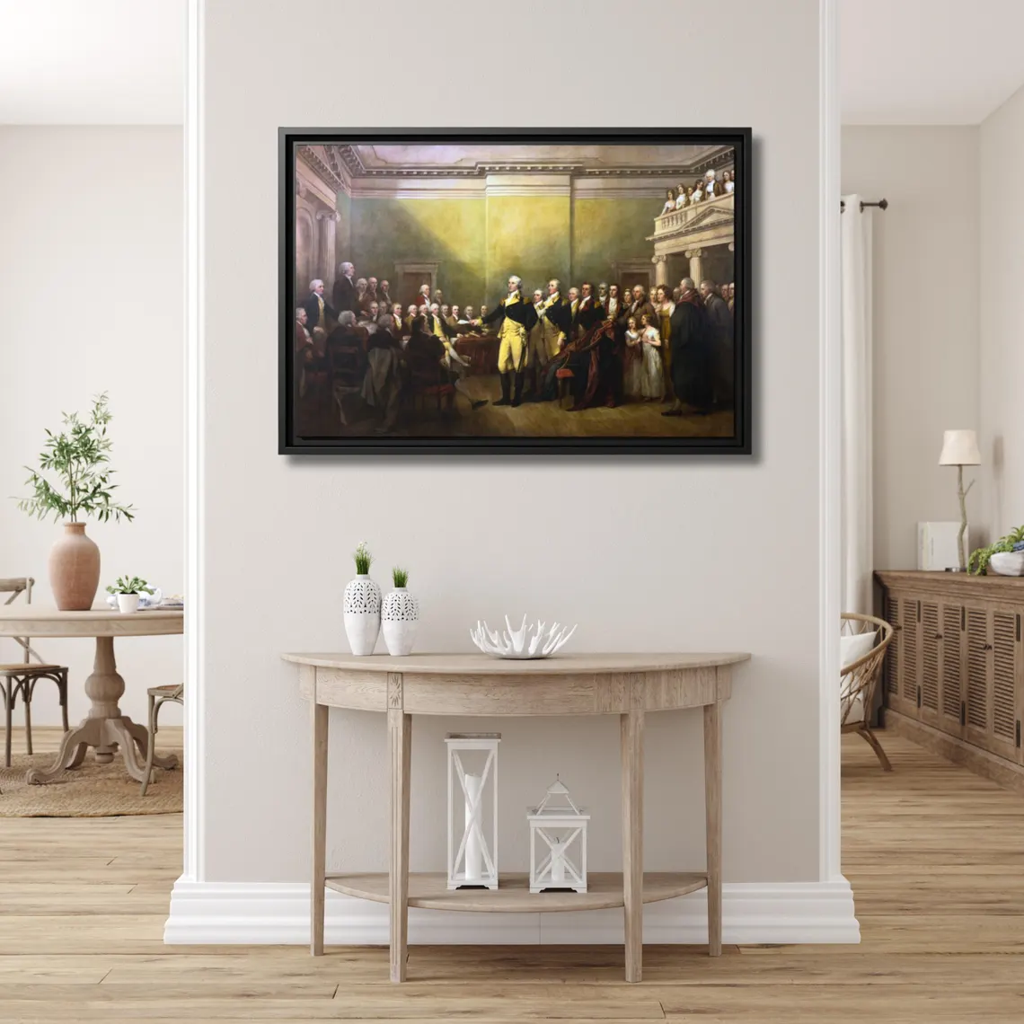 General George Washington Resigning His Commission framed canvas above a light demi-lune console table in a bright airy entryway